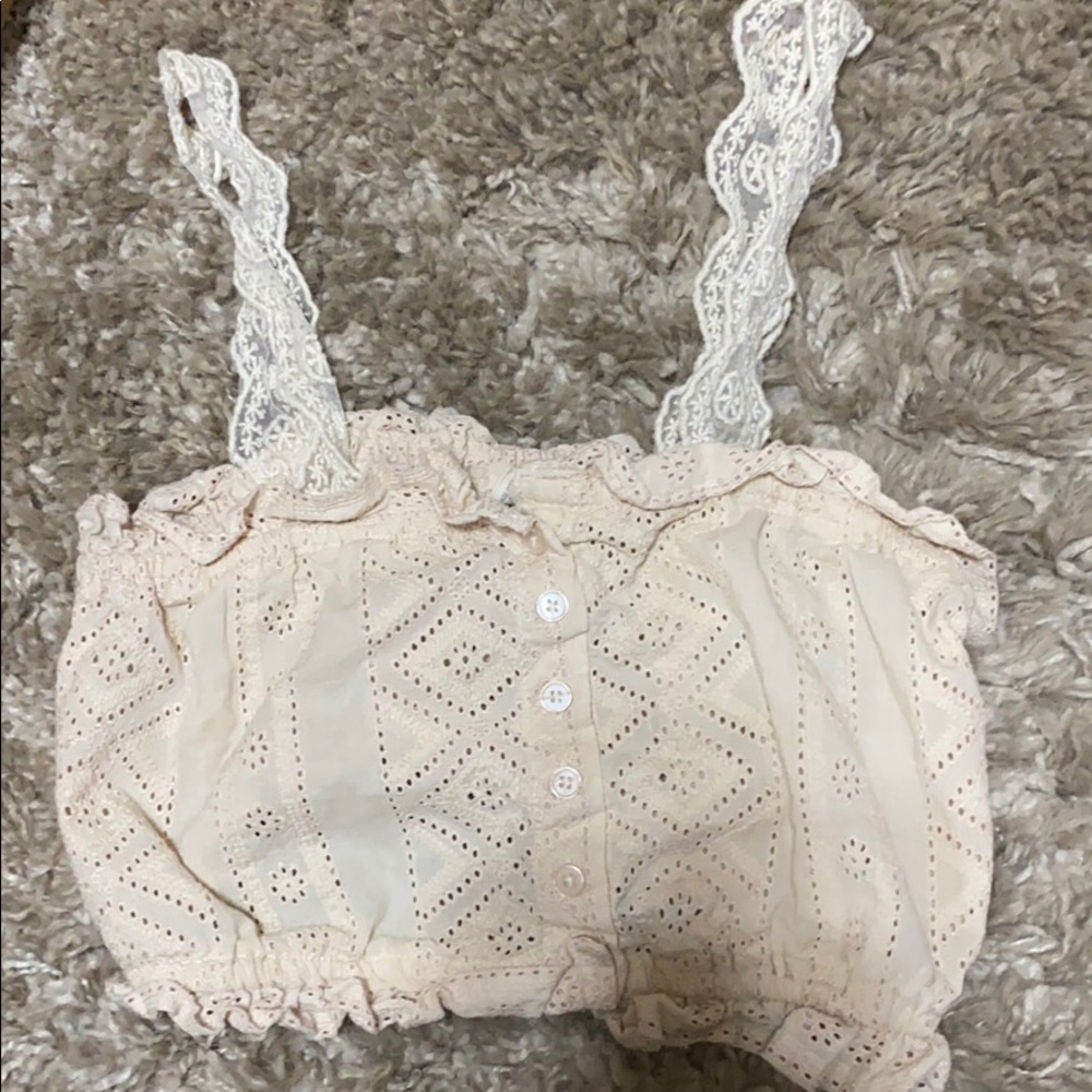 A cropped button strapped shirt